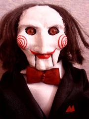 кукла Билли из х/ф «Пила».  